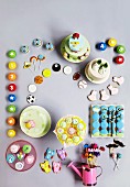 A selection of cakes and cookies for a birthday party (top view)