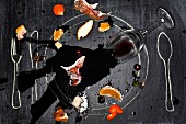 Wine glass and food spilled onto chalkboard