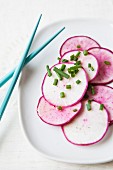 Sliced radishes on plate