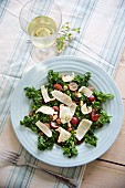 Green kale salad with grapes, hazelnuts and Parmesan