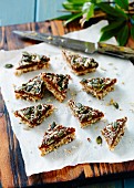 Seed and grain triangles with dates and pumpkin seeds