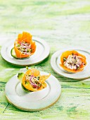 A salad of edible shoots in carrot bowls