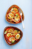 Tomato salad with grilled courgette and green olives
