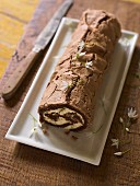Chocolate Swiss roll with flowers
