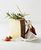 Still life featuring Manchego, saffron, rosemary and chilli