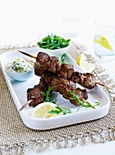 Lamb kebabs with tzatziki and rocket