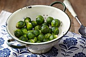 Steamed Brussels sprouts in a colander