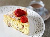 A slice of gluten-free cheesecake with strawberries