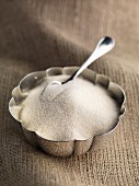 Granulated cane sugar in a sugar bowl