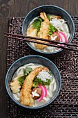 Udon noodle soup and tempura battered prawns