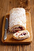 Sponge roll with cranberry jam and cream