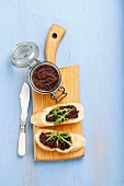 Slices of baguette with tapenade and rocket
