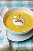 Cream of courgette soup garnished with sour cream