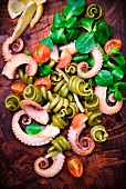 Pasta salad with octopus, tomatoes and lamb's lettuce