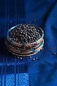 Beluga lentils on a blue silk sari, in a ring made from Indian bangles