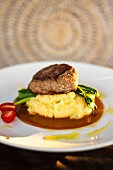 Beef fillet on mashed potato in a rosemary sauce