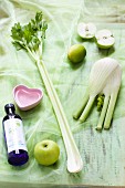 Ingredients for green vitamin juice (apple, celery, fennel, lime)