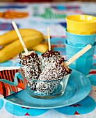 Frozen bananas with a chocolate and coconut glaze