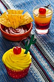 A Tequila Sunrise cupcake and cocktail