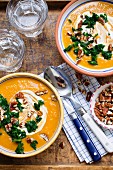 Sweet potato soup with green cabbage and pecan nuts