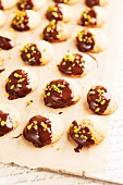 Biscuits with chocolate glaze and pistachio nuts