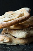 A stack of Fougasse bread close up.
