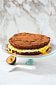 Chocolate mousse cake with cream and passion fruits