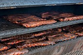 Racks of Spare Ribs Cooking on Grill