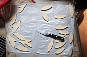 Leaf Cutouts for Pie Topping with Knife on Baking Pan
