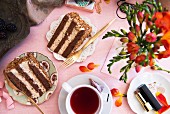 Two slices of chocolate cream cake and tea for Valentine's Day