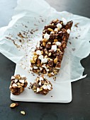 A chocolate bar with marshmallows and nuts