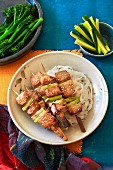 Chinese pork kebabs with rice noodles