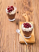 Chocolate mousse with cream and cranberries