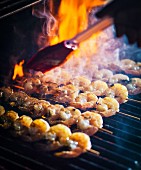 Prawn kebabs on a smoking barbecue