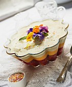 A sherry trifle with edible flowers