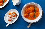 Poached apricots with cream and rosemary