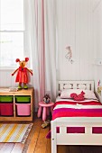 Colorful furniture in the children's room with wooden floor and wooden wall