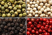 Different coloured peppercorns in a box