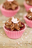 Chocolate cupcakes decorated with sugar peals and sugar flowers