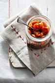 A jar of preserved tomatoes