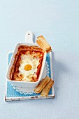 Baked egg with ham, tomato and mozzarella