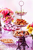 Mini sandwiches, biscuits and cupcakes for teatime
