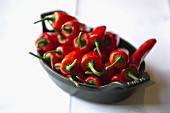 Fresh red chilli peppers in a baking dish