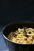 Pasta al limone (spaghetti with lemons, capers, raisins and pine nuts)
