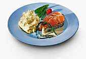 Salmon steak with mashed potatoes and vegetables