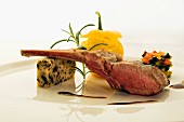 Saddle of lamb with pepper polenta and olive bread