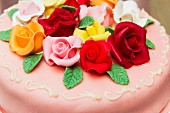 A celebratory cake decorated with roses