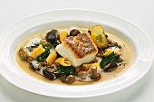 Zander fillet in a smoked mushroom broth with spinach and baby gnocchi