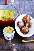Meatballs with mashed potato and mustard