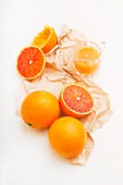 Sicilian half blood oranges: whole, halved and juiced
